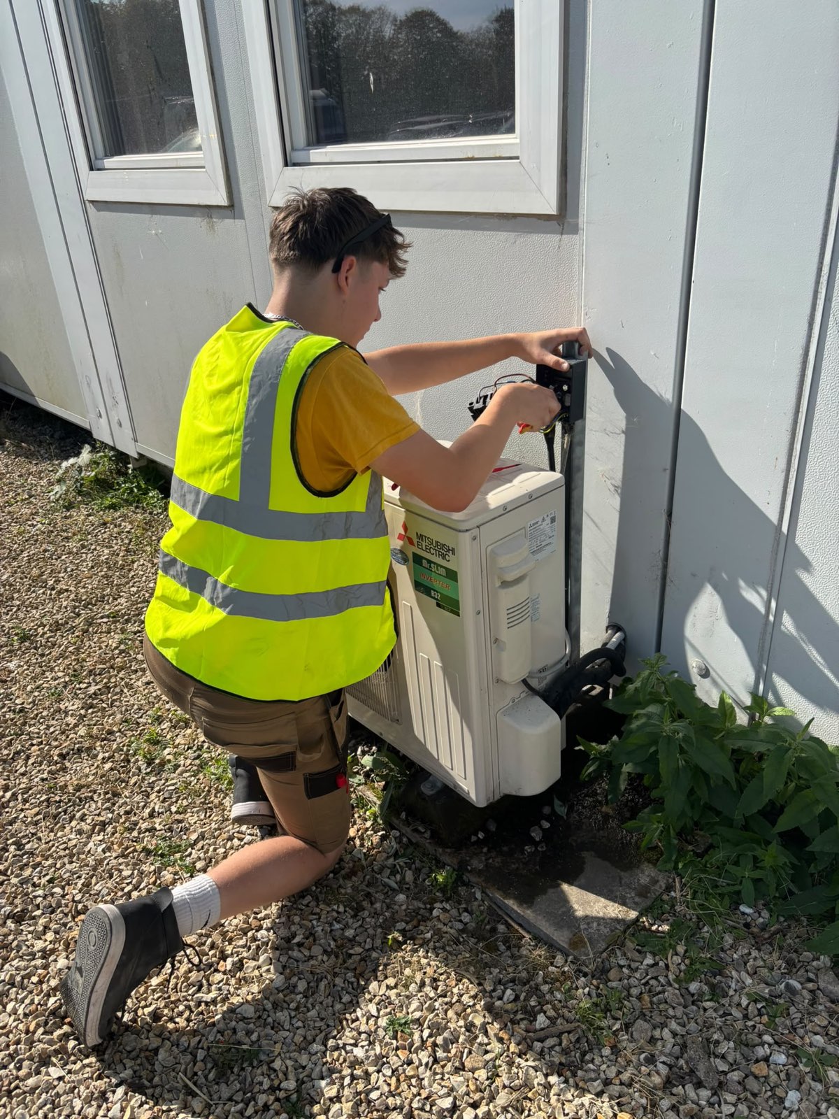 GRID engineer servicing plant at a commercial site