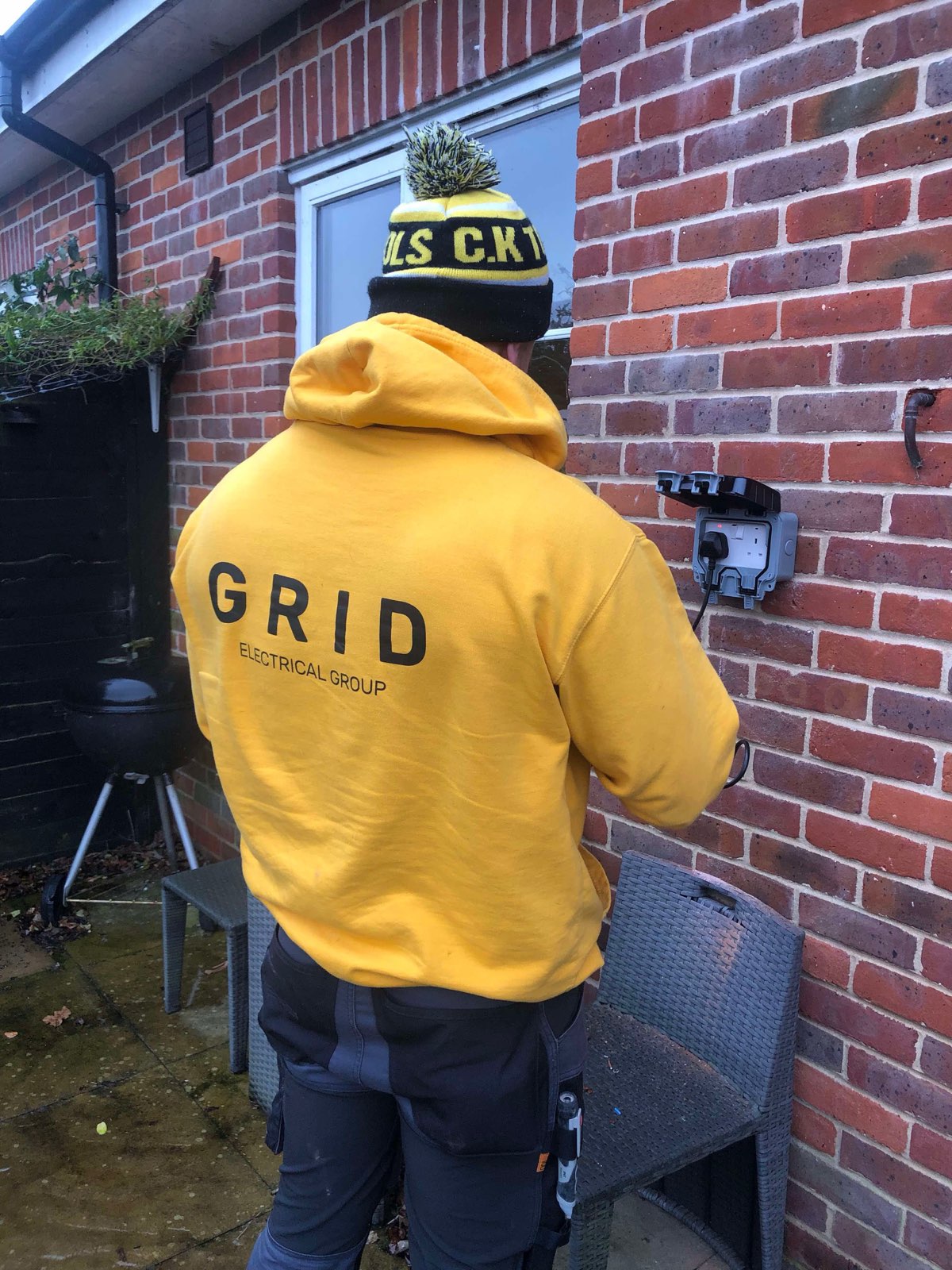 Outdoor socket installation at a rental property